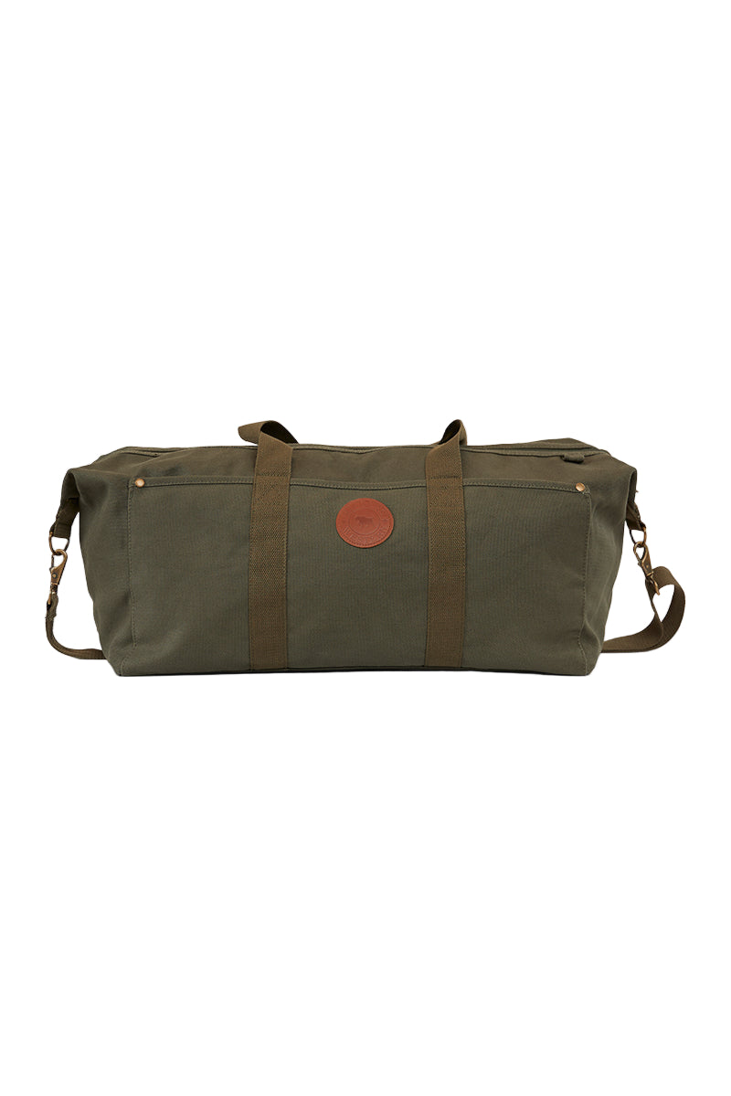 A military green Kirkwood duffle bag made of cotton canvas with leather accents and a shoulder strap.
