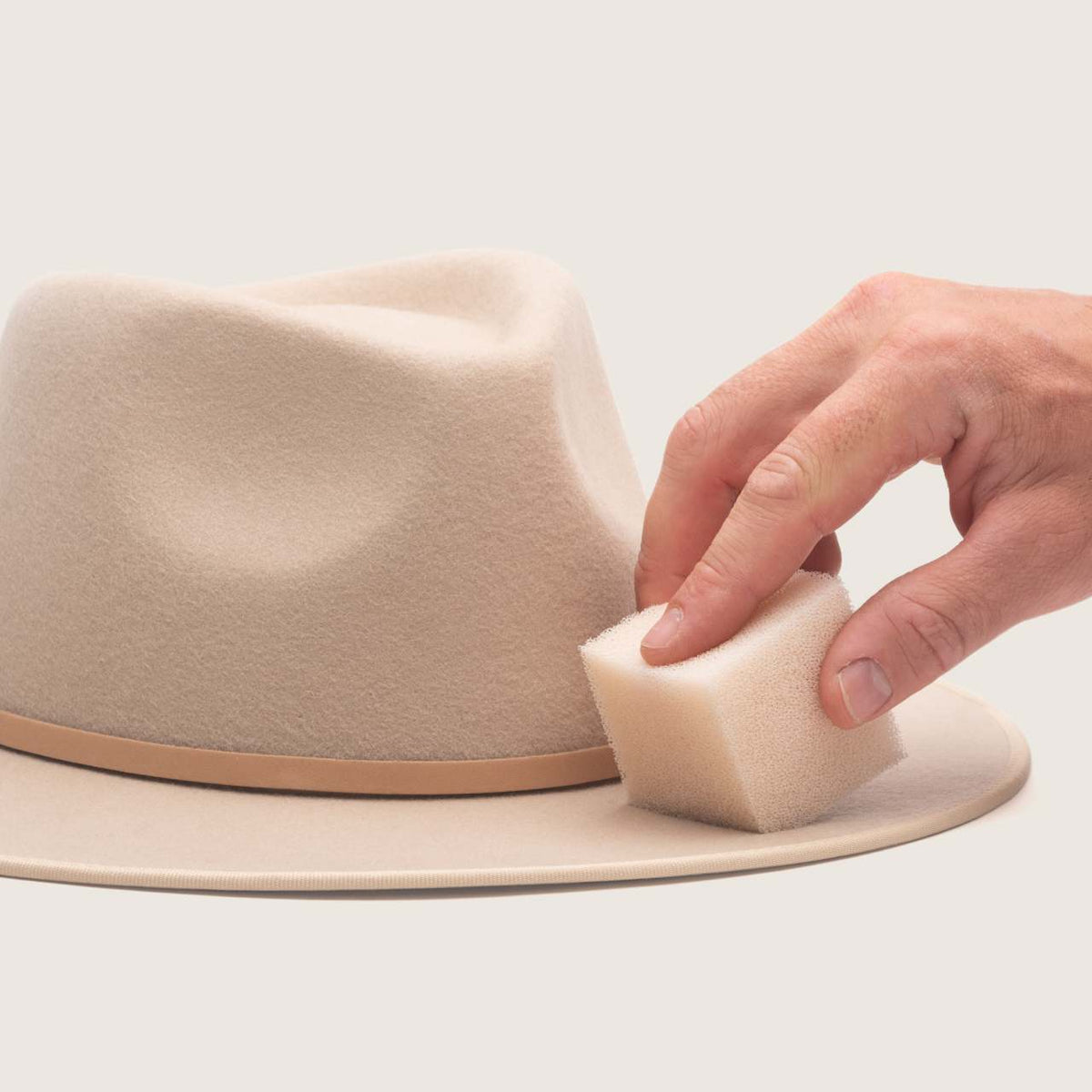 Hat Sponge in use on a felt hat